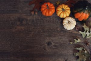 autumn-decorations-on-a-wooden-background