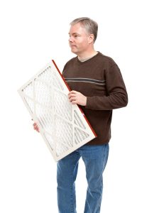 person-holding-an-air-filter